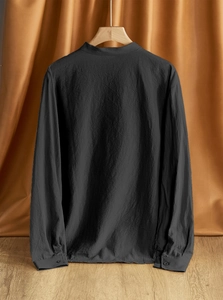 Detail of men's linen shirt back texture and standing collar in charcoal black