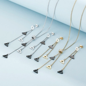 Detail of silver and gold geometric tassel jewelry sets with triangle pendants and zircons