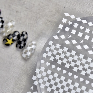 Japanese style nail art stickers with white geometric patterns heart star and checkerboard