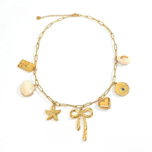 Detail view of 18k gold plated chain with seashell, starfish, and evil eye charms