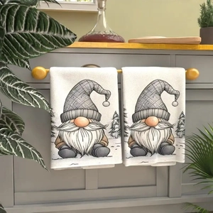 Close-up of microfiber Christmas kitchen towel with gnome print hanging in kitchen