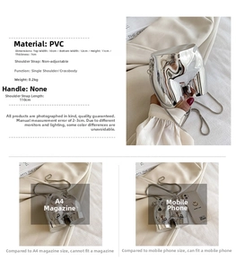 Macro detail of silver mirror PVC mini hip-shaped bag with slim metal chain strap