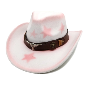 Detail of white felt cowboy hat featuring pink star patterns and bull head buckle