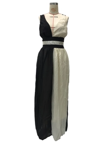 Detail of a black and white sleeveless dress featuring a color-block panel design