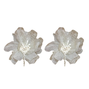 Elegant champagne gold mesh flower earrings with central white pearls on white background