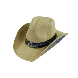 Detail of western straw cowboy hat featuring USA flag elements and metal eagle emblem