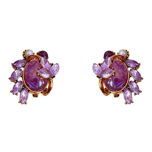 Vintage gold earrings with purple oval stones and zircon leaf design on white background