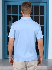 Back view of light blue men's short-sleeve polo shirt showing collar and fabric texture