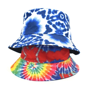 Detail showing two reversible tie-dye bucket hats stacked on a clean white background