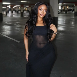 Detail of sheer black mesh bodycon maxi dress featuring a slim-fit silhouette