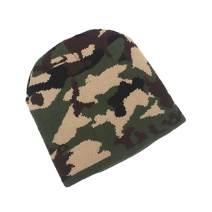 Detail of knit texture and woodland camouflage pattern on the warm beanie hat