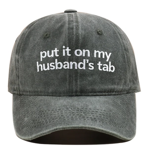 Close-up of Put It On My Hubby's Tab white embroidery on washed dark grey cotton cap