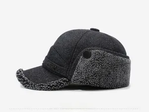Side view of dark grey winter trapper hat with warm lamb wool lining and metal buckle detail