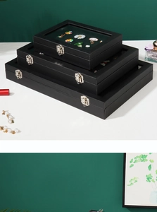 Three sizes of black badge display boxes with glass windows and metal locks for storage