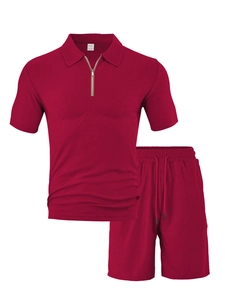 Detail of burgundy towel jacquard polo and shorts set showing fabric texture and M label