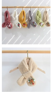 Detail of soft plush kids' scarves with Christmas ornaments in various colors