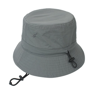 Detail of grey bucket hat featuring breathable side vents and adjustable chin strap