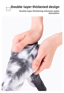 Close-up of double-layer thickened microfiber cat print towel showing plush fabric texture