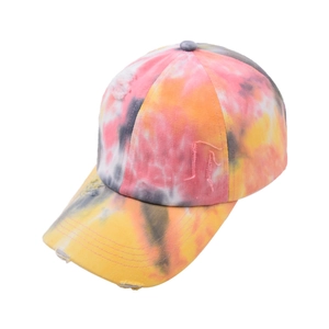 Detailed view of the tie-dye cotton canvas baseball cap with distressed edge details