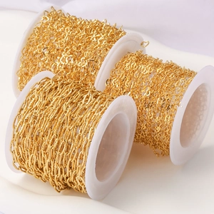 Three spools of golden stainless steel heart and flat link chains for jewelry making