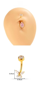 Macro view of titanium belly ring with gold finish and zircon butterfly design details