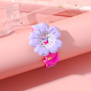 Detailed view of purple flower dial and pink butterfly embossed silicone strap for kids