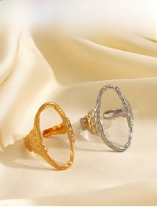Detailed close-up of gold and silver hammered texture adjustable open rings