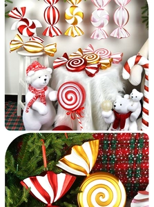Macro view of metallic spiral candy ornaments on Christmas tree branch decorations