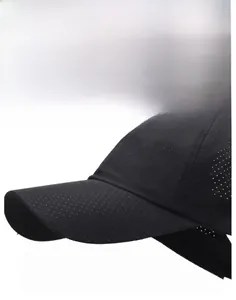 Close-up of black breathable baseball cap with laser-cut holes for ventilation
