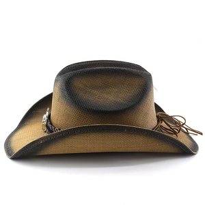Detail of woven straw cowboy hat featuring ethnic pattern band and silver buckle accents
