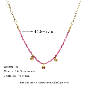 Detail of 18K gold-plated necklace with colorful natural stone beads and floral pendants