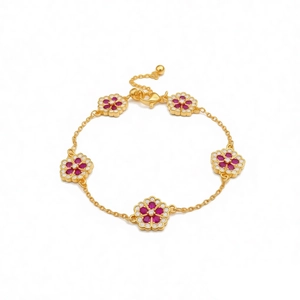 Elegant 18k gold plated flower bracelet featuring vibrant red and white crystals