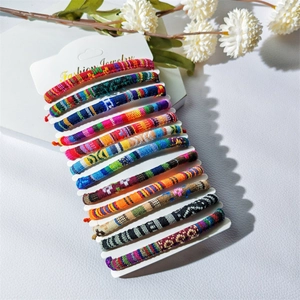 Detailed view of bohemian woven surf bracelets in assorted colors on a jewelry display card