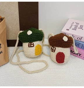 Detail of mushroom shaped knitted crossbody bags in green and brown color options
