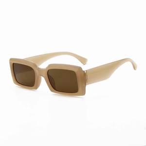 Detail view of the wide beige resin temples and dark brown lenses of these square sunglasses