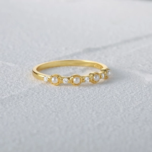 Detail shot of S925 sterling silver ring with delicate pearls and sparkling diamonds