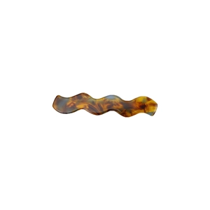 Minimalist wavy acetate hair clip with vintage tortoise shell pattern on white background