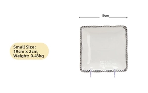 Detail view of small white ceramic square plate with silver beaded rim 19x2cm dimensions