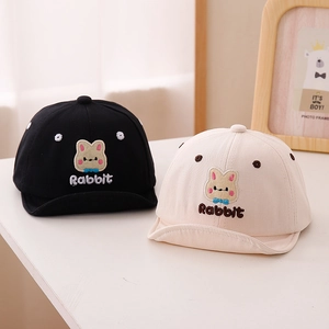 Close-up of soft cotton baby baseball caps with cute rabbit embroidery and folding brims