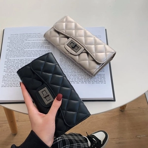 Elegant quilted faux leather long wallets in black and champagne gold with metal clasps