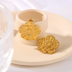 Elegant gold flower earrings in stainless steel with textured radial petals for women