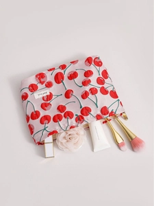 Pink makeup bag with red cherry prints and gold zipper for cosmetic storage