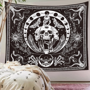 Detail of gothic tapestry featuring moth, skull and moon phase patterns for wall decor