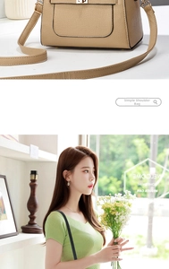 Close-up of litchi pattern leather shoulder bag with a gold metal twist lock buckle