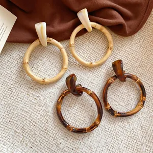 Retro geometric bamboo-style resin hoop earrings in wood and amber tones for women