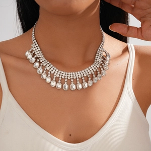 Close-up of luxury silver-toned choker necklace with multi-layer rhinestones and fringe