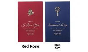 Detail of vintage greeting cards with metal charms and gold foil text on specialty paper