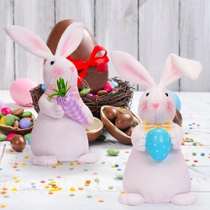 Easter bunny plush figurines set holding a purple carrot and blue polka dot egg ornament