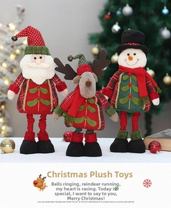 Detail of Christmas plush set featuring Santa, Reindeer and Snowman with gold bells