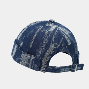 Detail of vintage navy denim miki hat with distressed texture and adjustable metal buckle